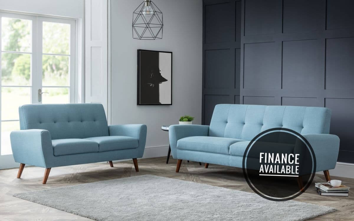 Two blue sofas in a furnished living room